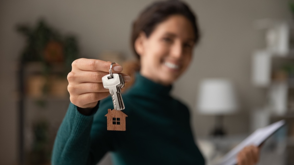 Real estate agent holding house keys